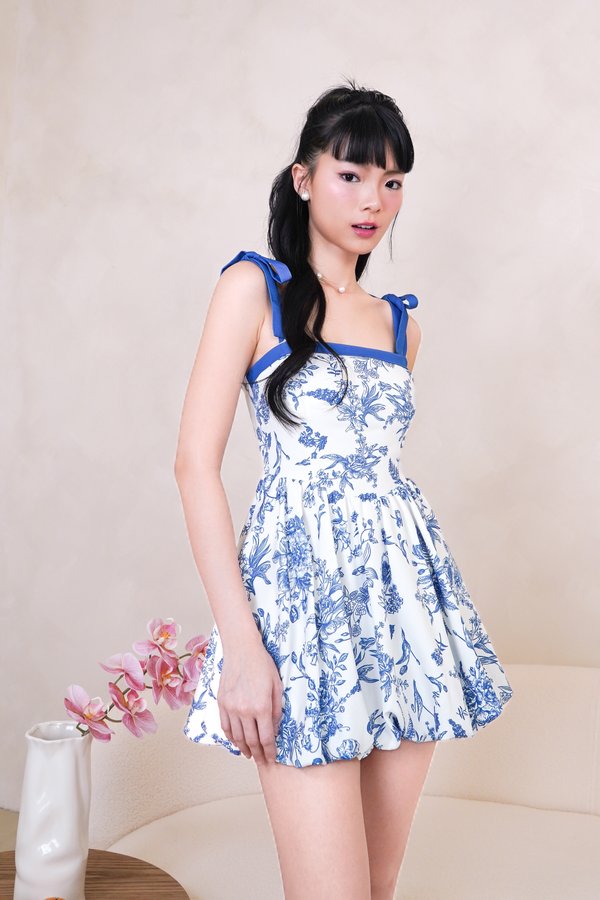 L575 Camryn Ribbon Strap Bubble Hem Dress Romper in Blue Printed Floral