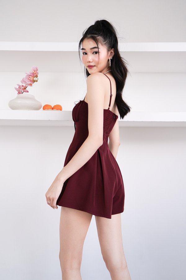 Derine Ruched Ribbon Romper in Maroon